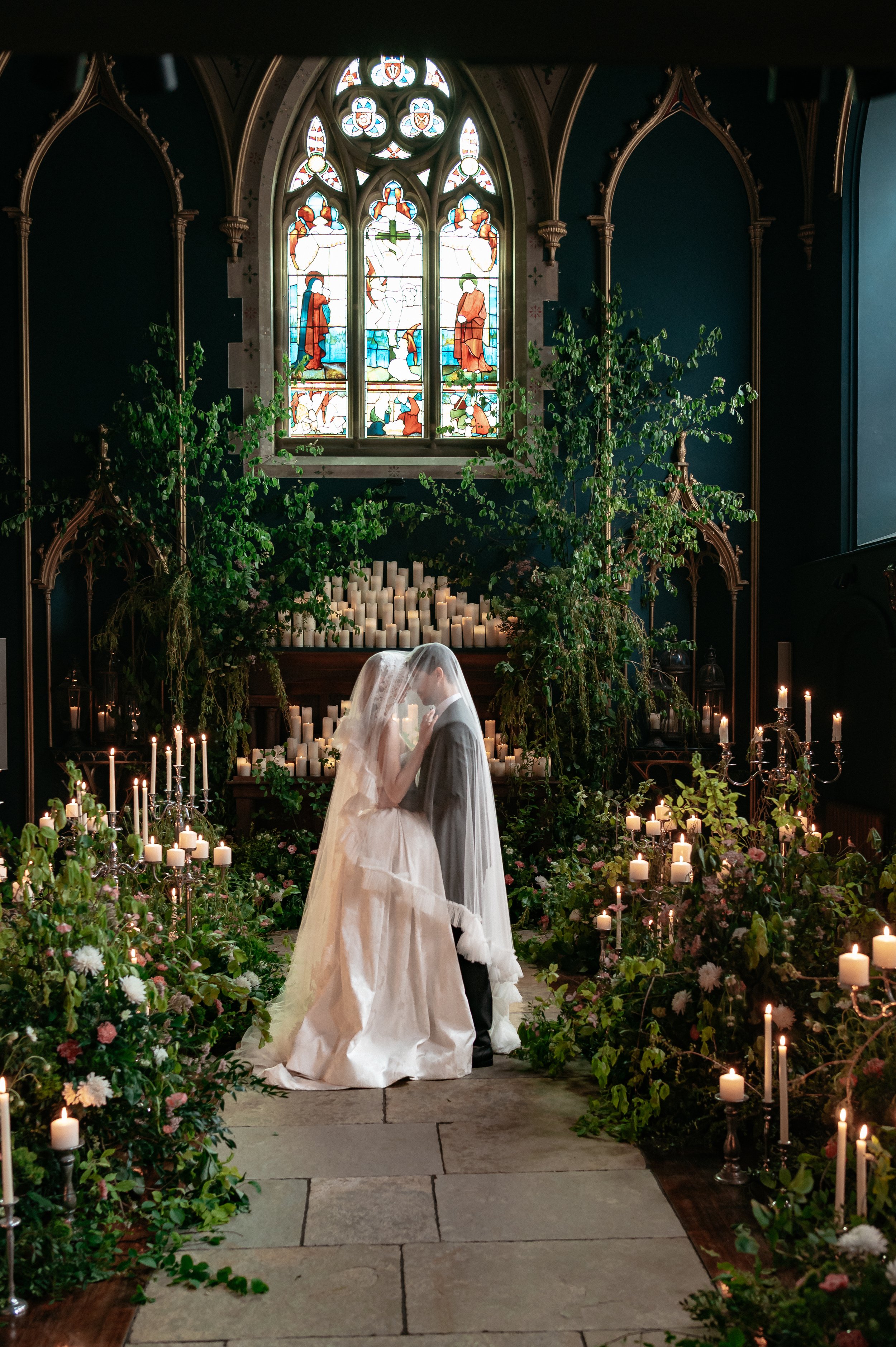 Couple having a moment at the bottom of the aisle