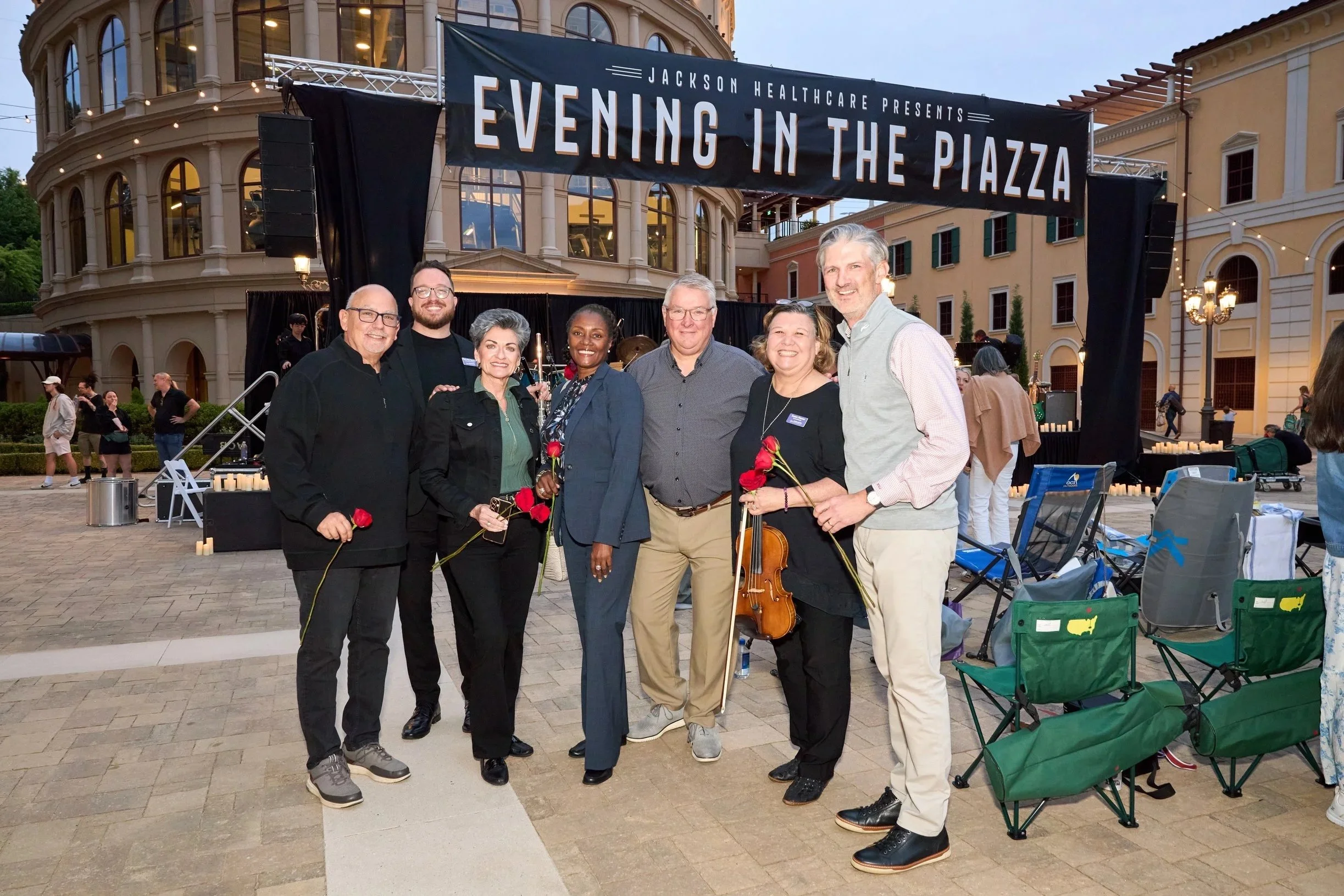 Jackson Healthcare special event. People standing in front of event sign.
