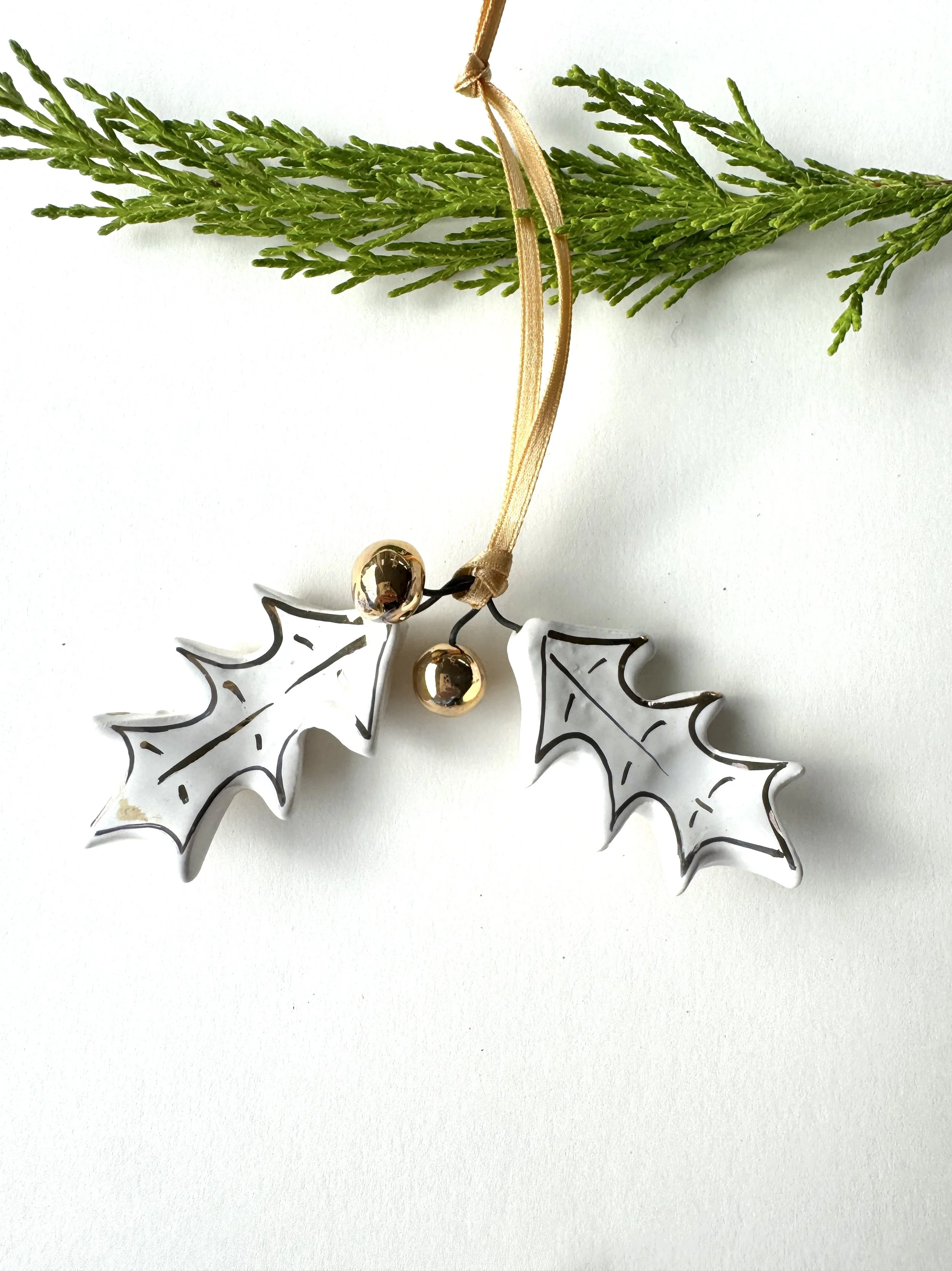 Holly leaves with gold berries