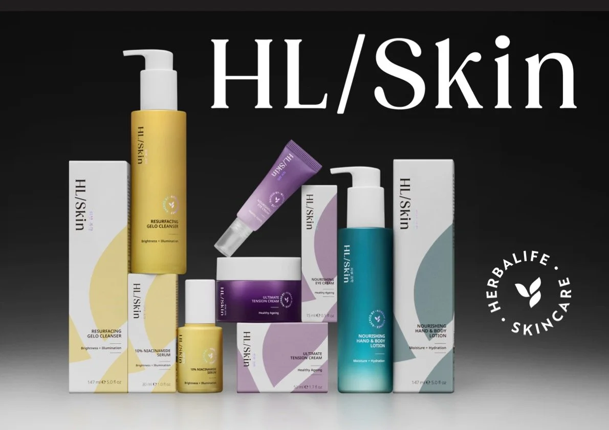 Collection of HL/Skincare products including cleansers, serums, creams, and lotions displayed with packaging and boxes, branded as Herbalife SKIN, against a black background.