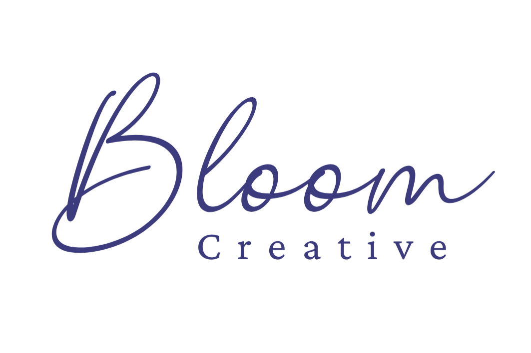 Logo with the words 'Bloom Creative' in navy script and serif fonts on a white background.