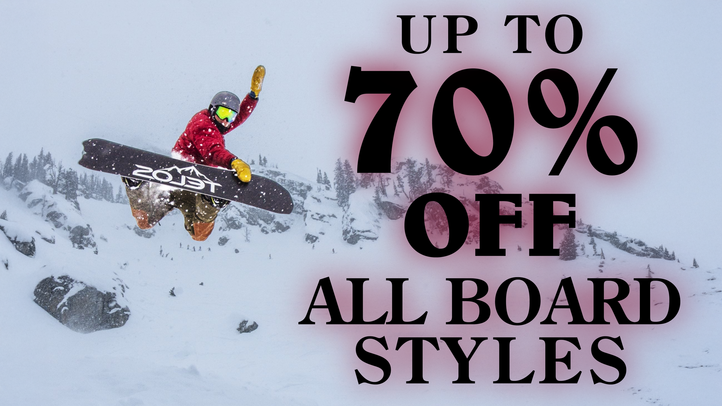 A snowboarder in mid-air jumping over snow-covered rocks and trees in a snowy mountain landscape, with promotional text advertising up to 70% off all board styles.