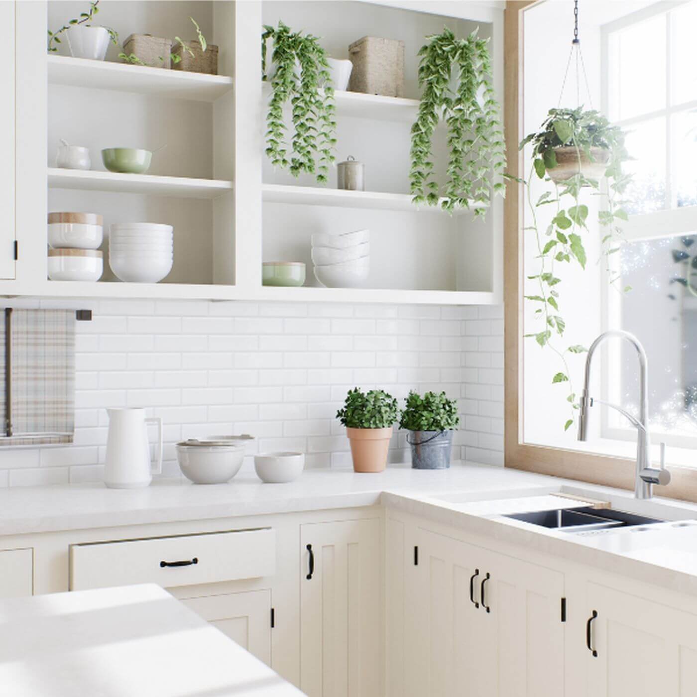 Bright, organized kitchen with open shelving, white cabinets, plants, and neatly arranged everyday items.