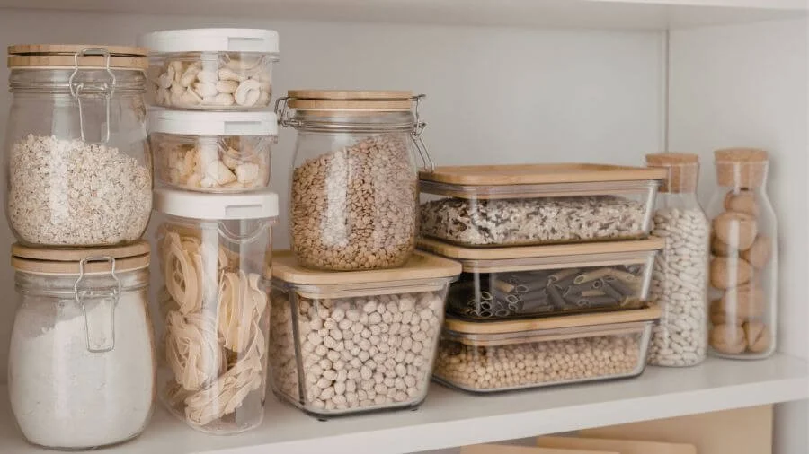 Organized pantry with clear storage containers, pantry staples, and functional shelving for easy access.