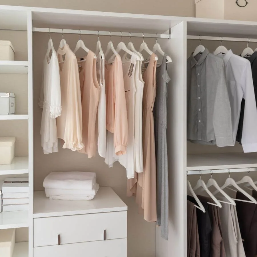 Organized closet with neatly arranged clothing, open shelving, and spacious storage for easy everyday access.