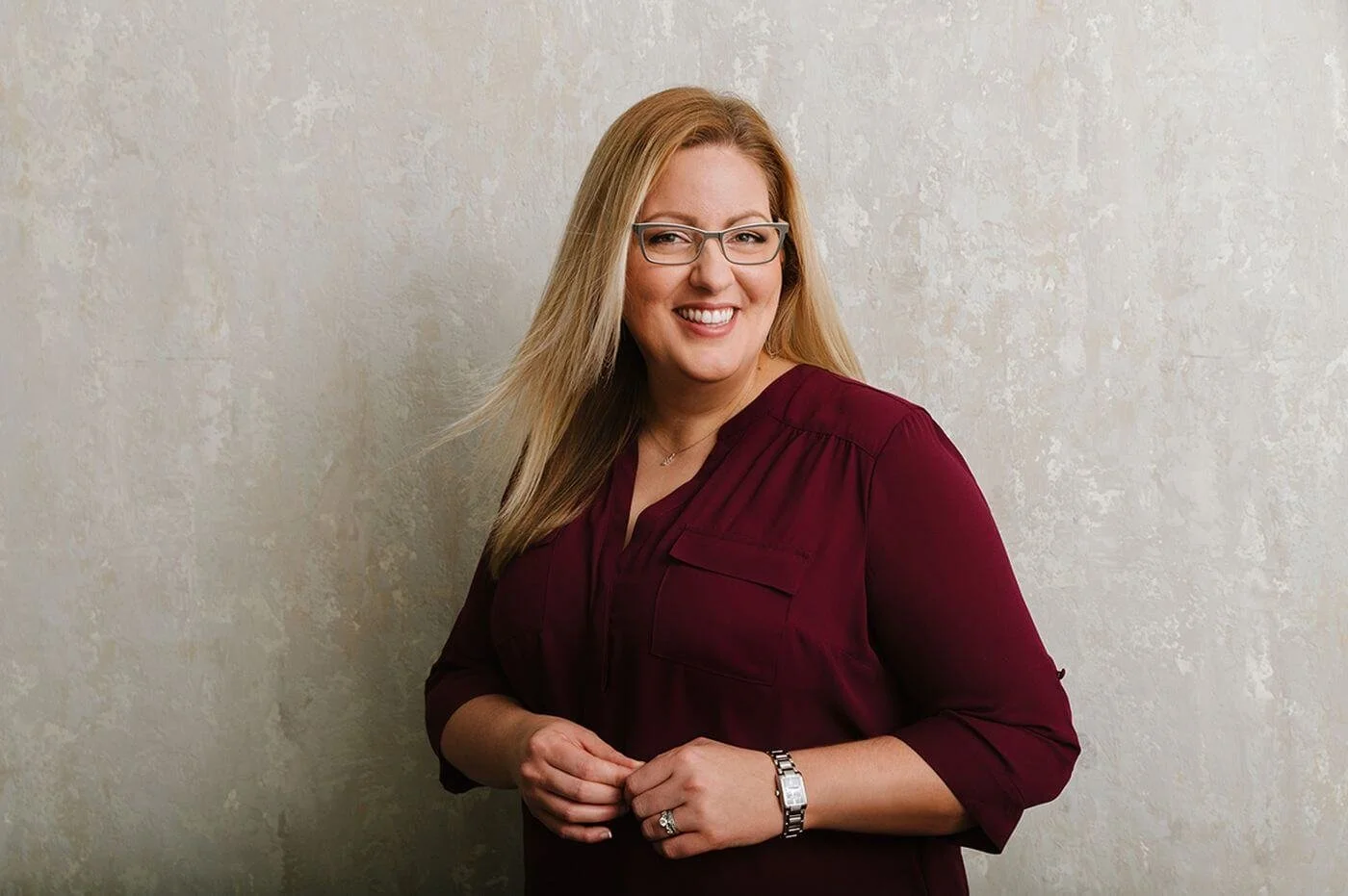 Aleah Duitsman, professional organizer, smiling warmly in a portrait with a friendly and approachable expression.