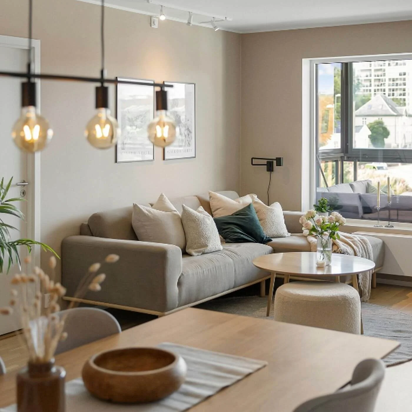 Organized family room with neutral colors, comfortable seating, and a calm, welcoming atmosphere.
