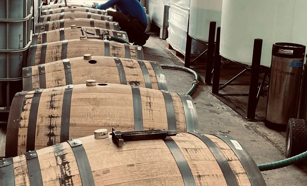 A row of oak casks await being filled with Warrior Whiskey®.