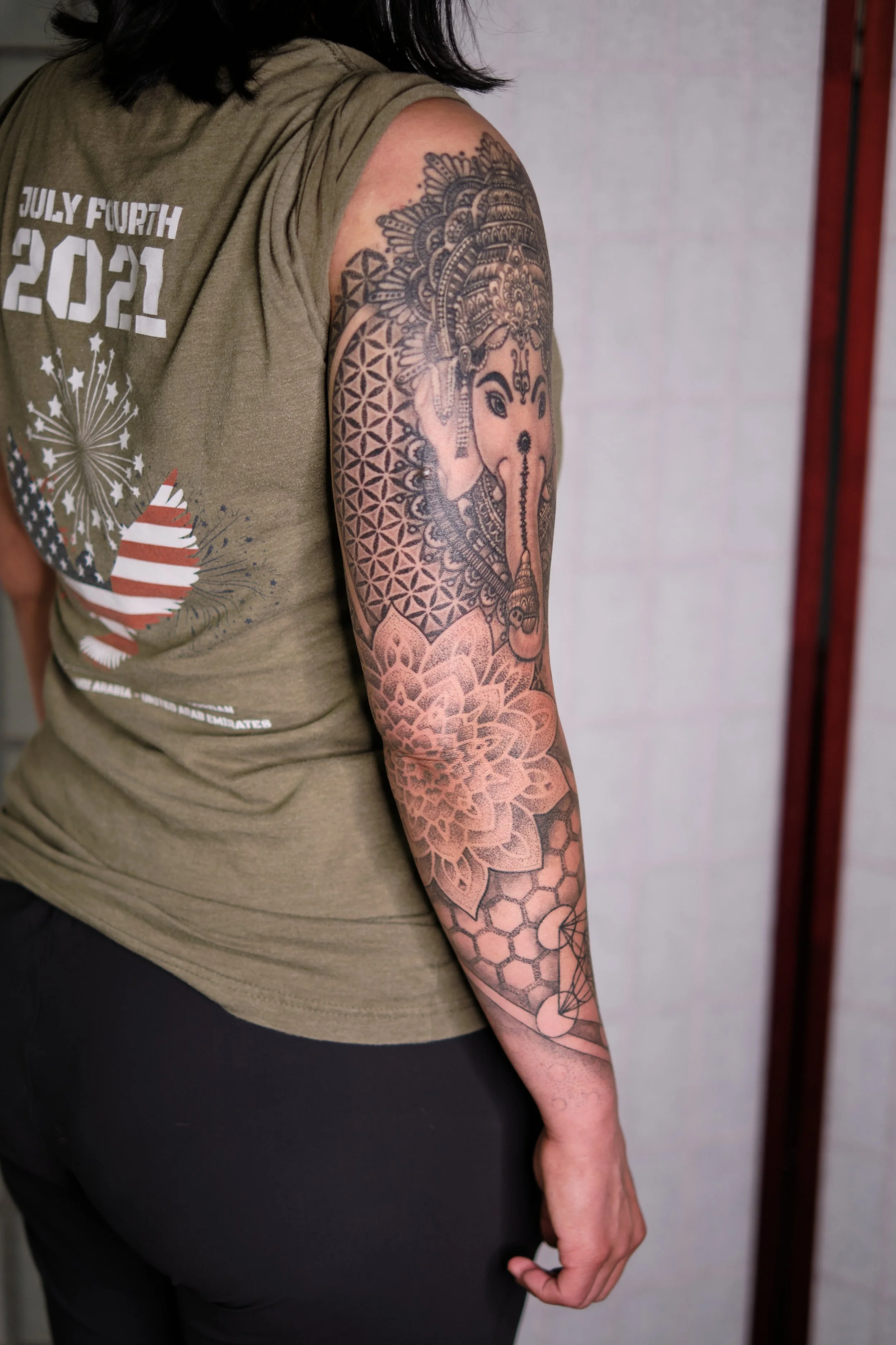 Geometry arm sleeve tattoo with a mandala elbow (photo 2 years healed)