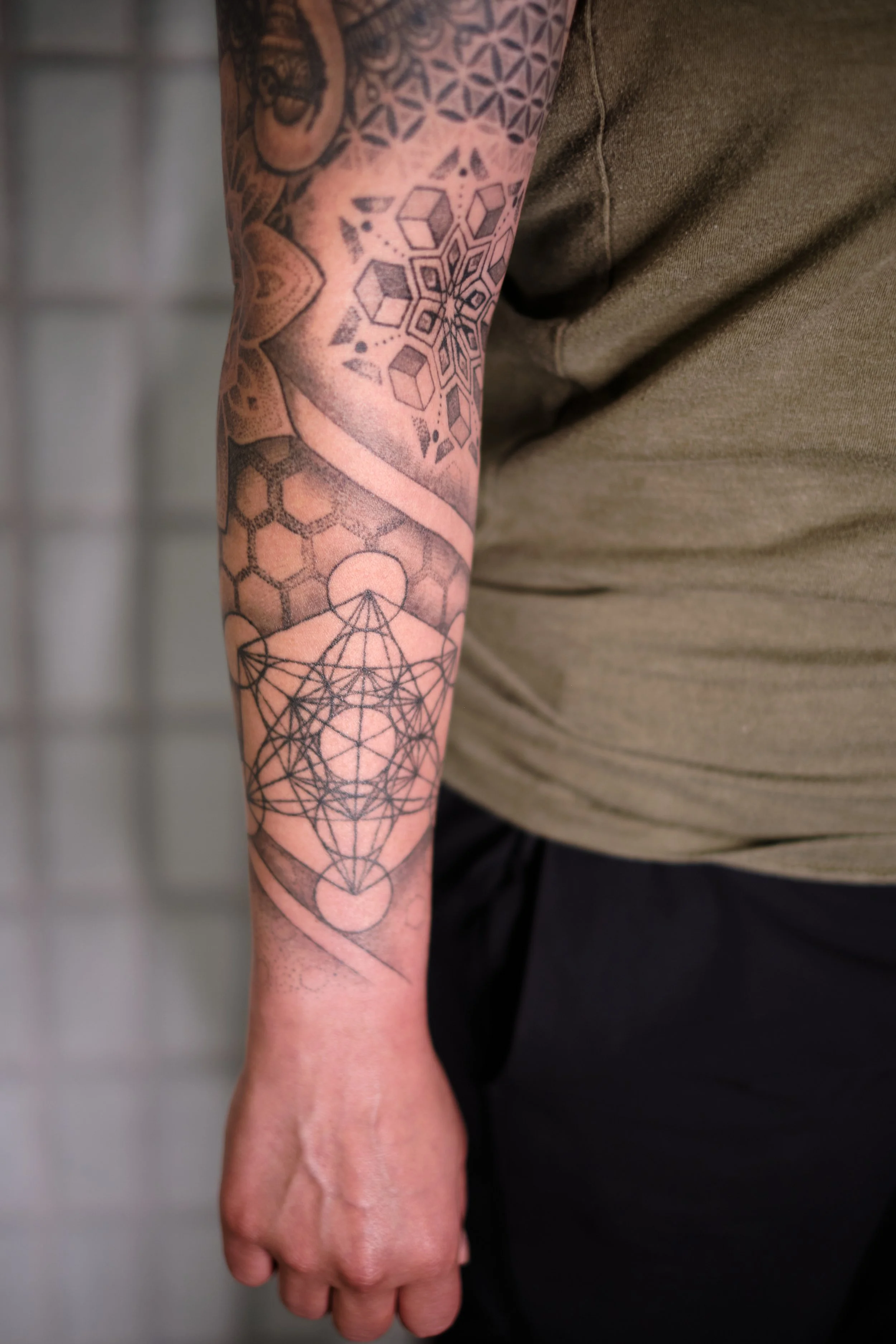 Geometry arm sleeve tattoo (photo 2 years healed)