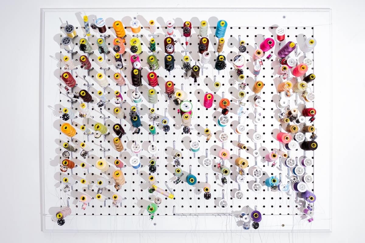 Sewing thread on peg board.jpg