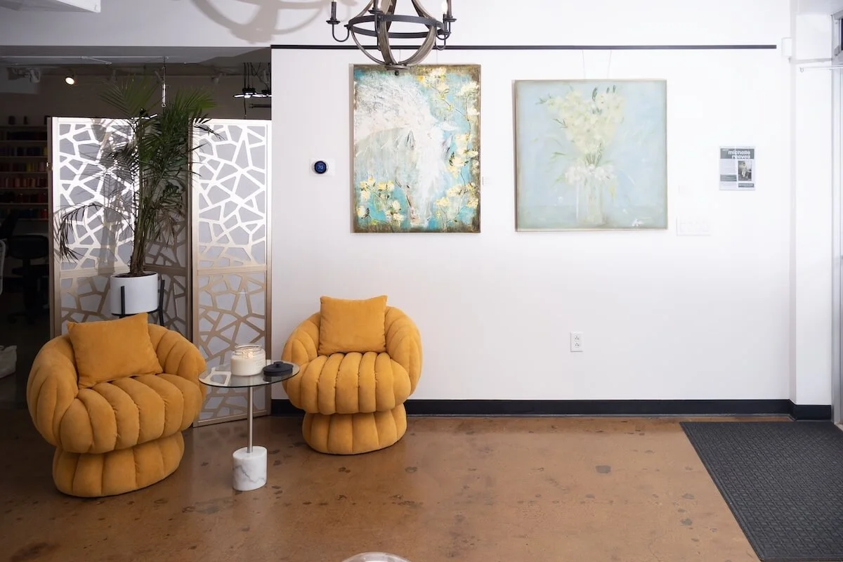 Yellow chairs and paintings.jpg