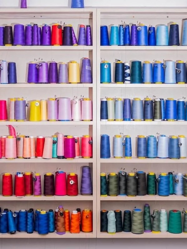 Colorful thread on shelves