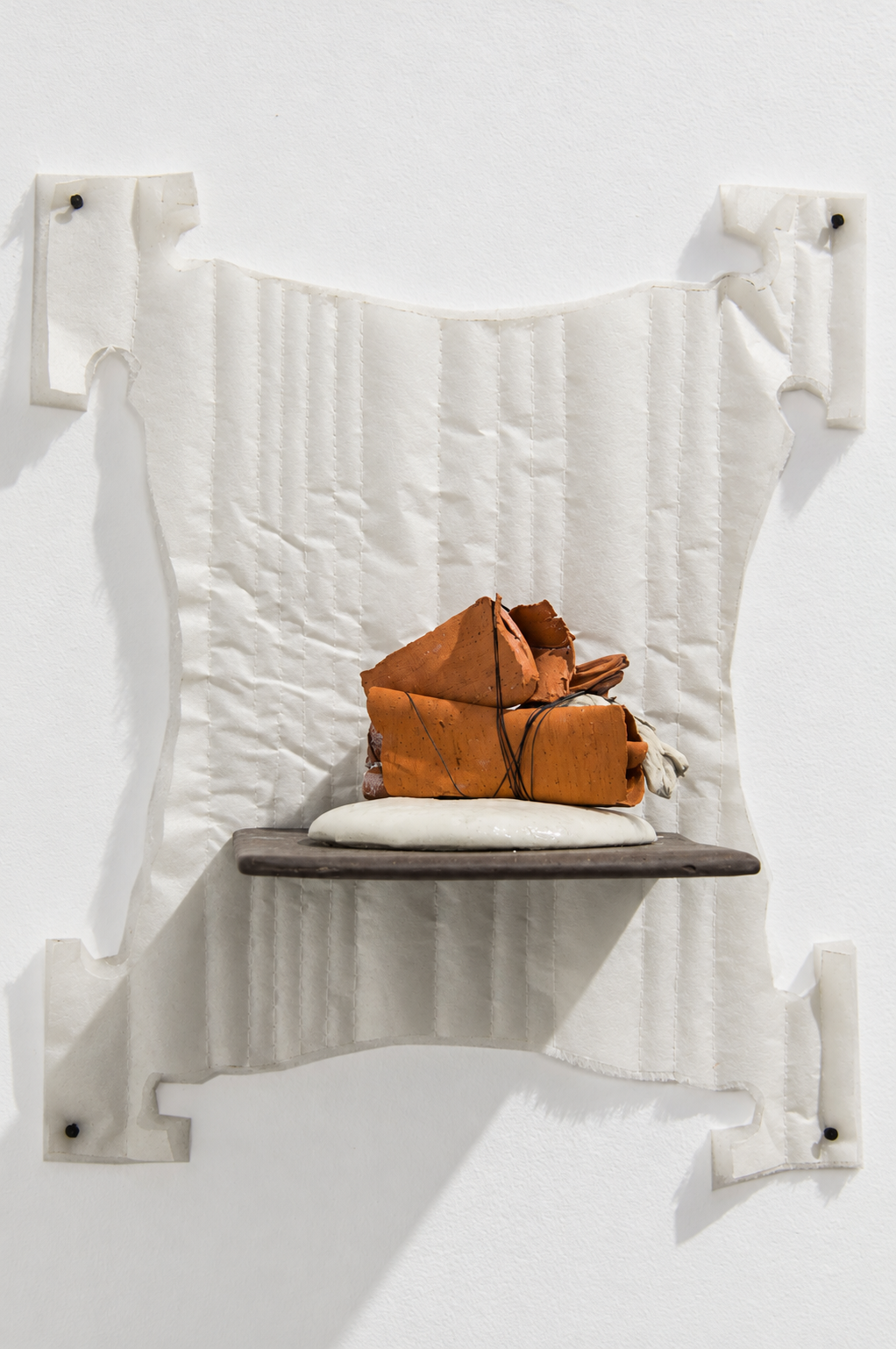 interchange . 2016 . ceramic, thread, foam, batting, parchment paper, upholstery tacks