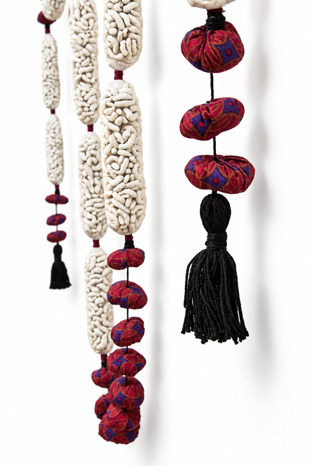 reminder/maggot . 2016 . porcelain, netting, fabric, tassels