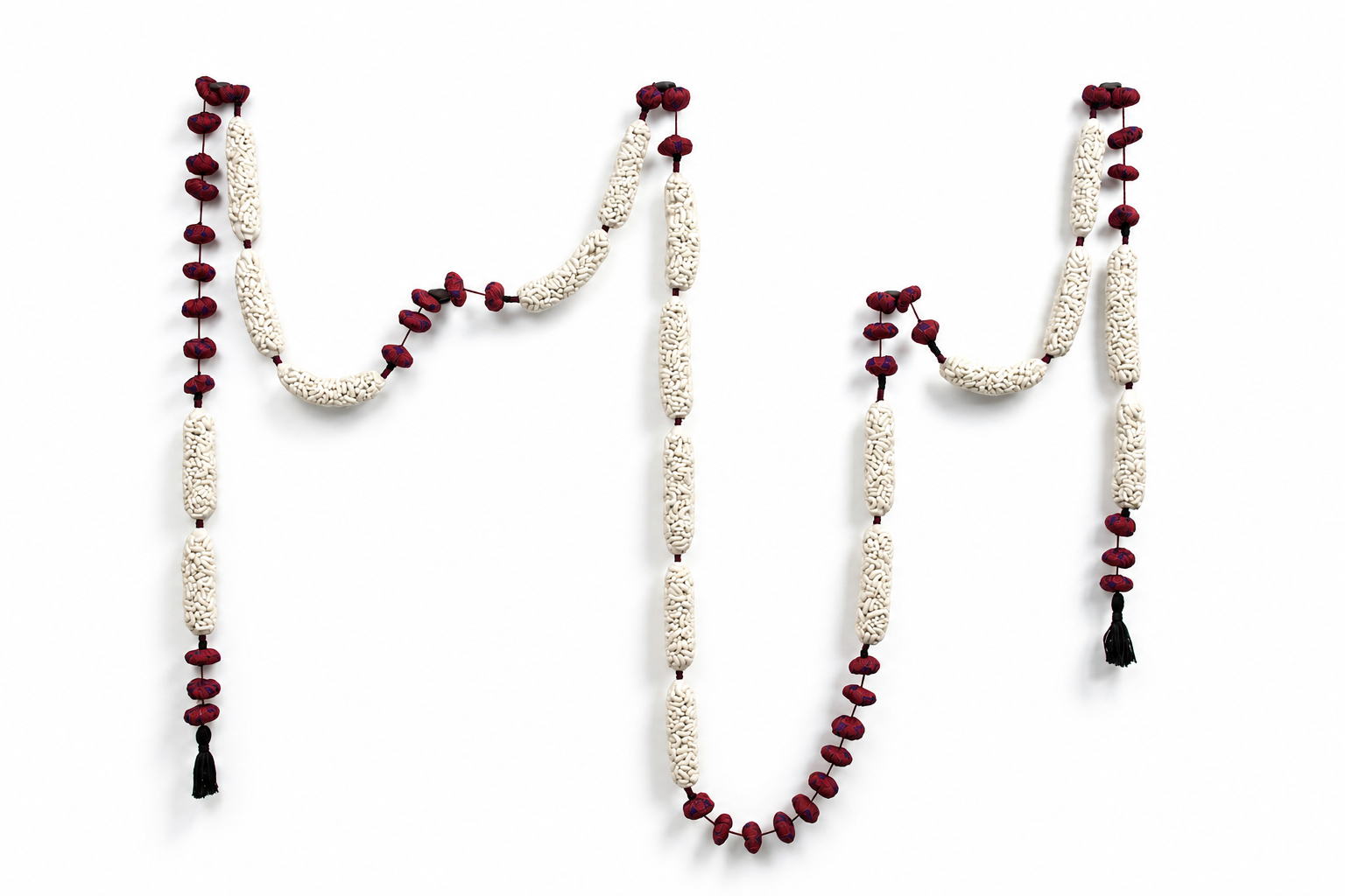 reminder/maggot . 2016 . porcelain, netting, fabric, tassels