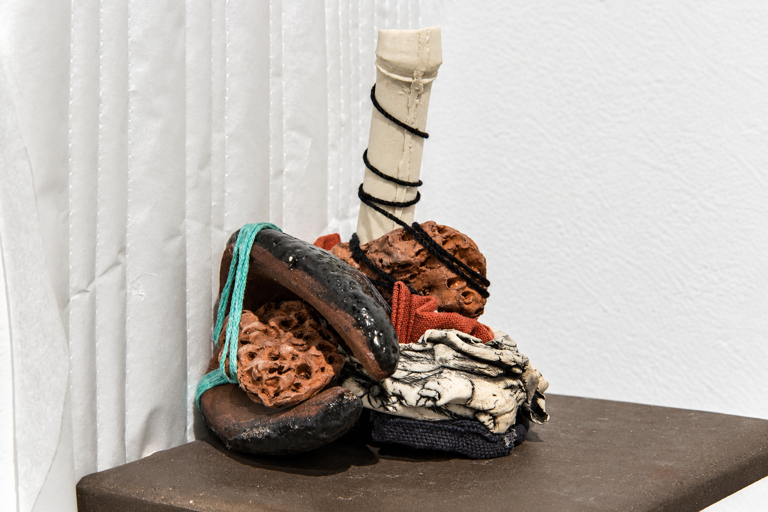 interchange . 2016 . ceramic, thread, fabric, batting, parchment paper, upholstery tacks