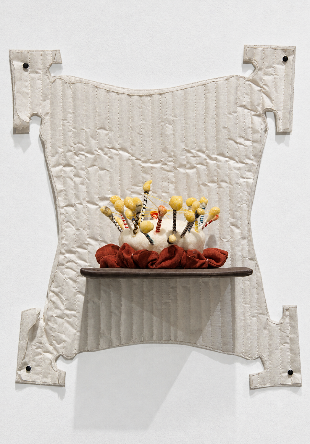interchange . 2016 . ceramic, cotton swabs, resin, thread, foam, fabric, batting, parchment paper, upholstery tacks