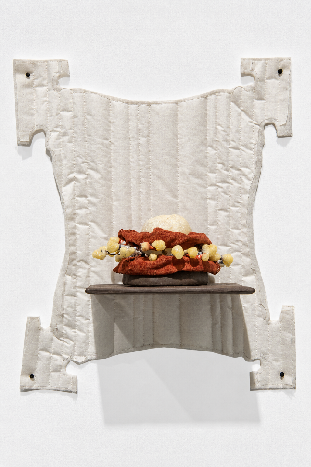 interchange . 2016 . ceramic, cotton swabs, resin, thread, foam, fabric, batting, parchment paper, upholstery tacks
