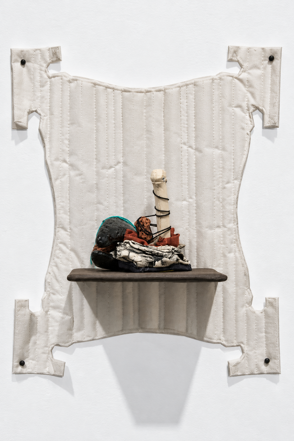 interchange . 2016 . ceramic, thread, fabric, batting, parchment paper, upholstery tacks