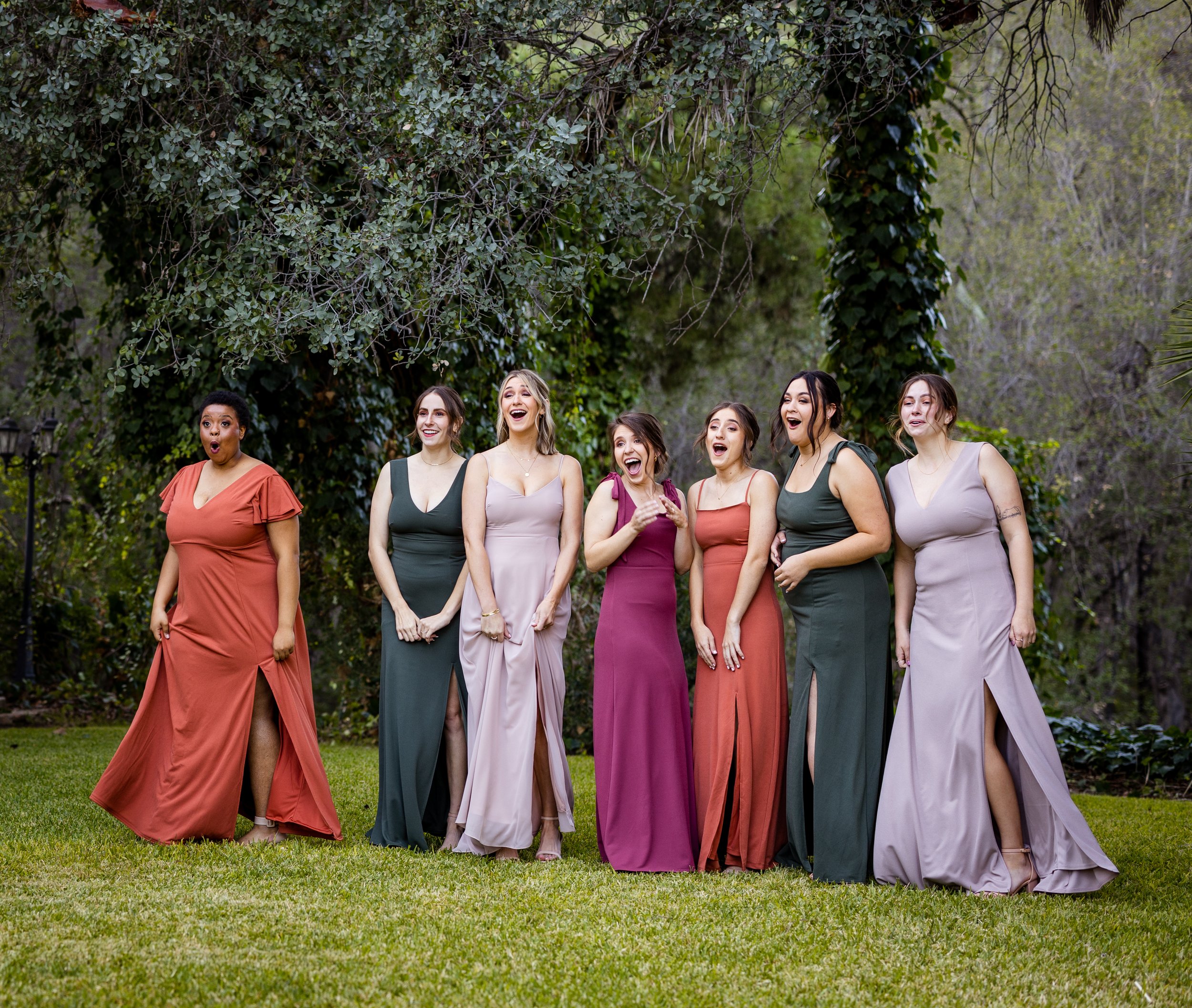 Bridesmaids reaction to bride mixed matched dresses in california