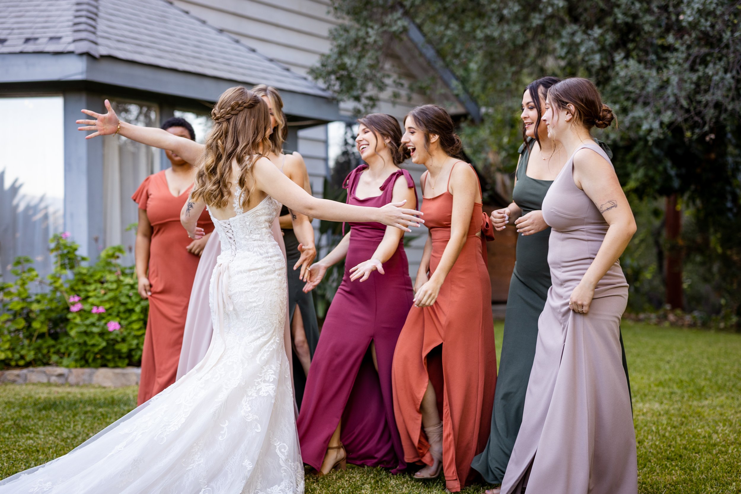 candid moment with bridesmaids in southern california wedding in wine country 