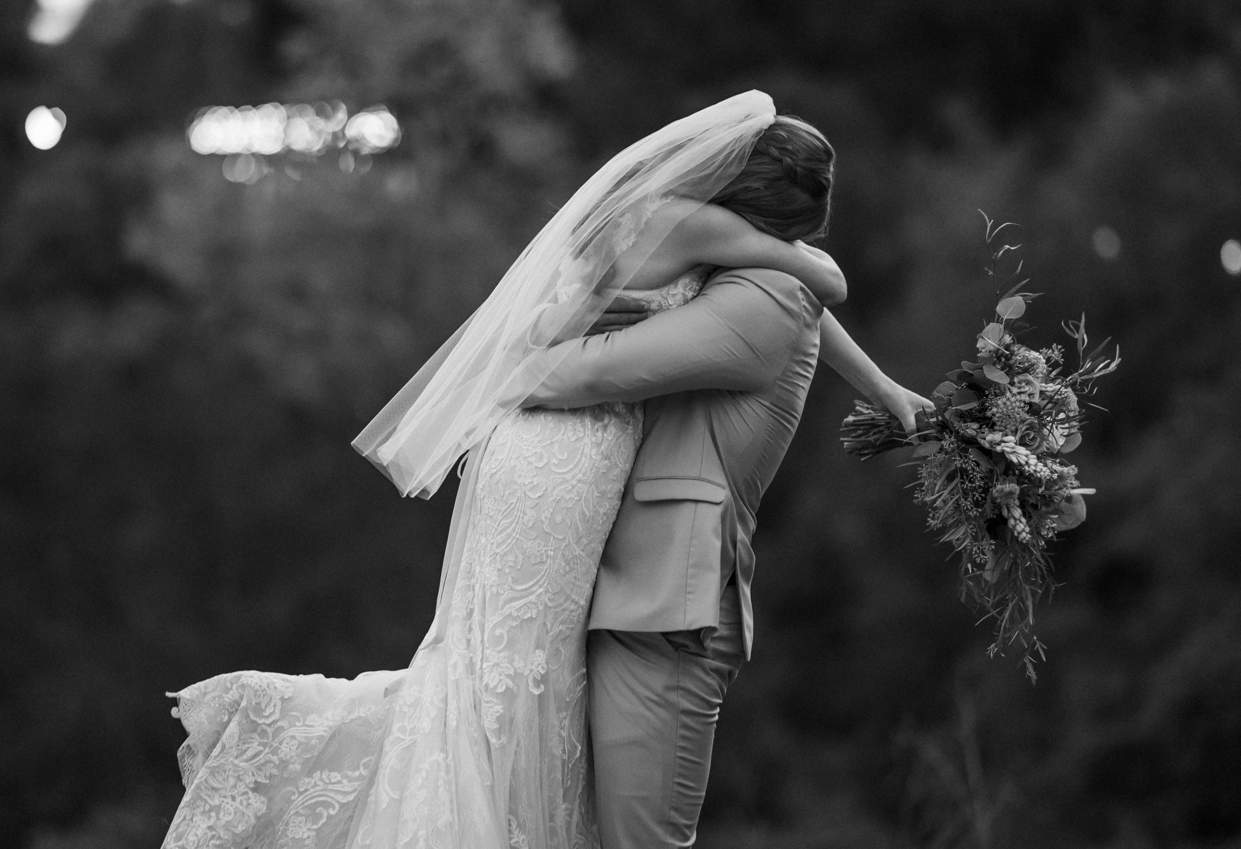 black and white couple hugging authentic moment at wedding in california