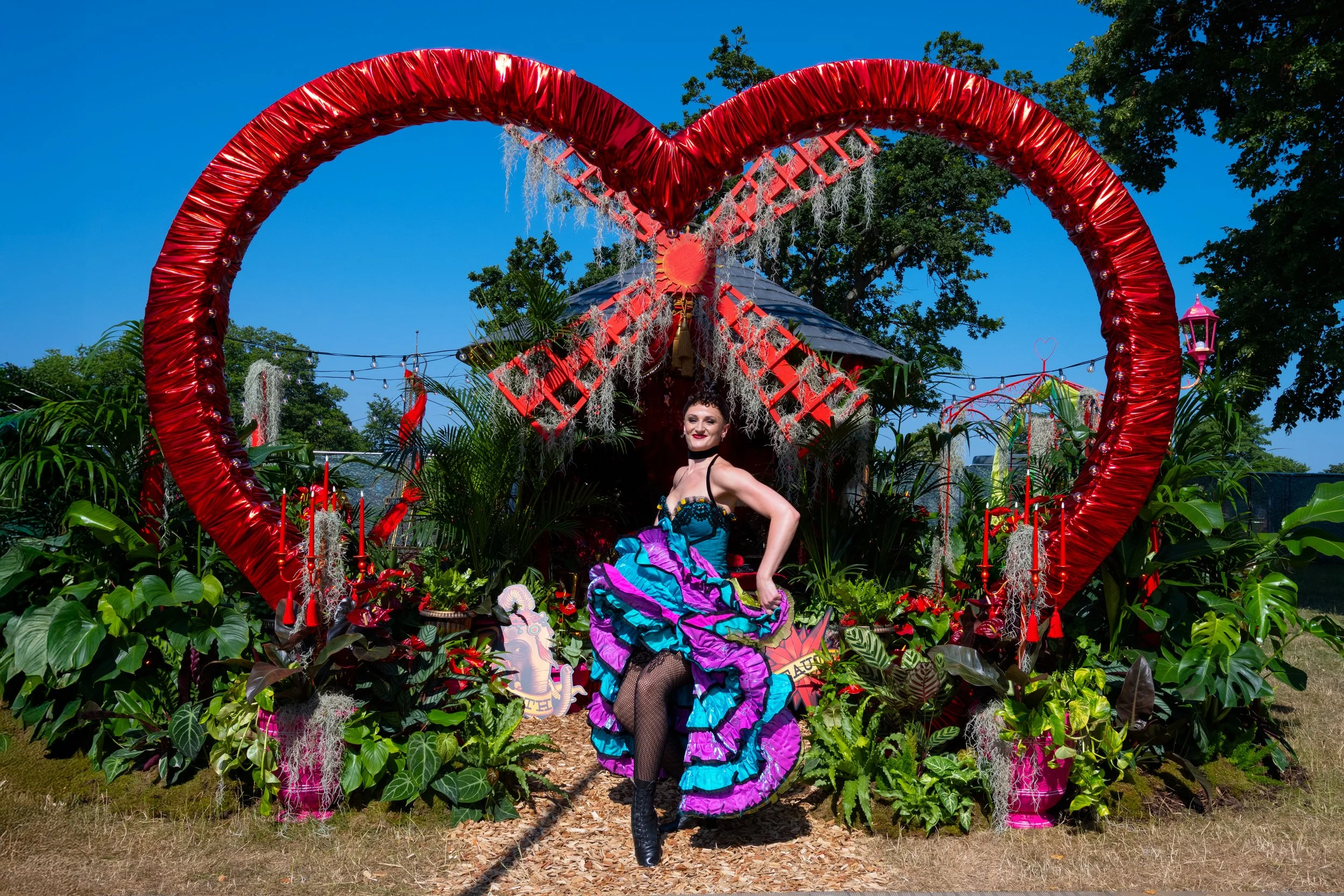 Cast member Catrin Thomas on L'amour Vert for Moulin Rouge! The Musical at RHS Badminton Flower Show 2026 Designed by James Whiting and Plants By There - RHS Gold Medal and Best Houseplant Terrarium