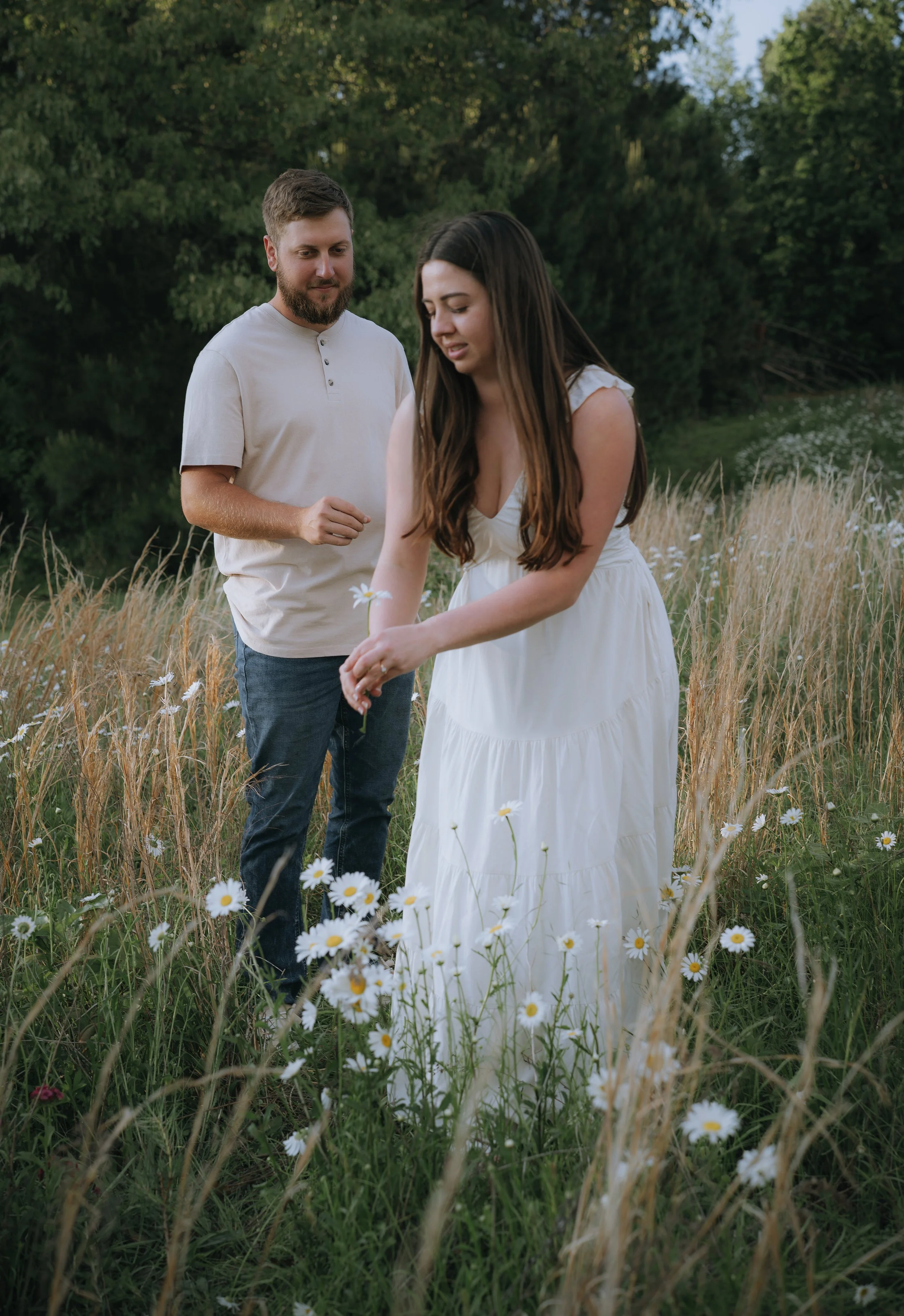 bride and groom walking in field during engagement photo session at Honey Hill Farms in Mayfield Kentucky