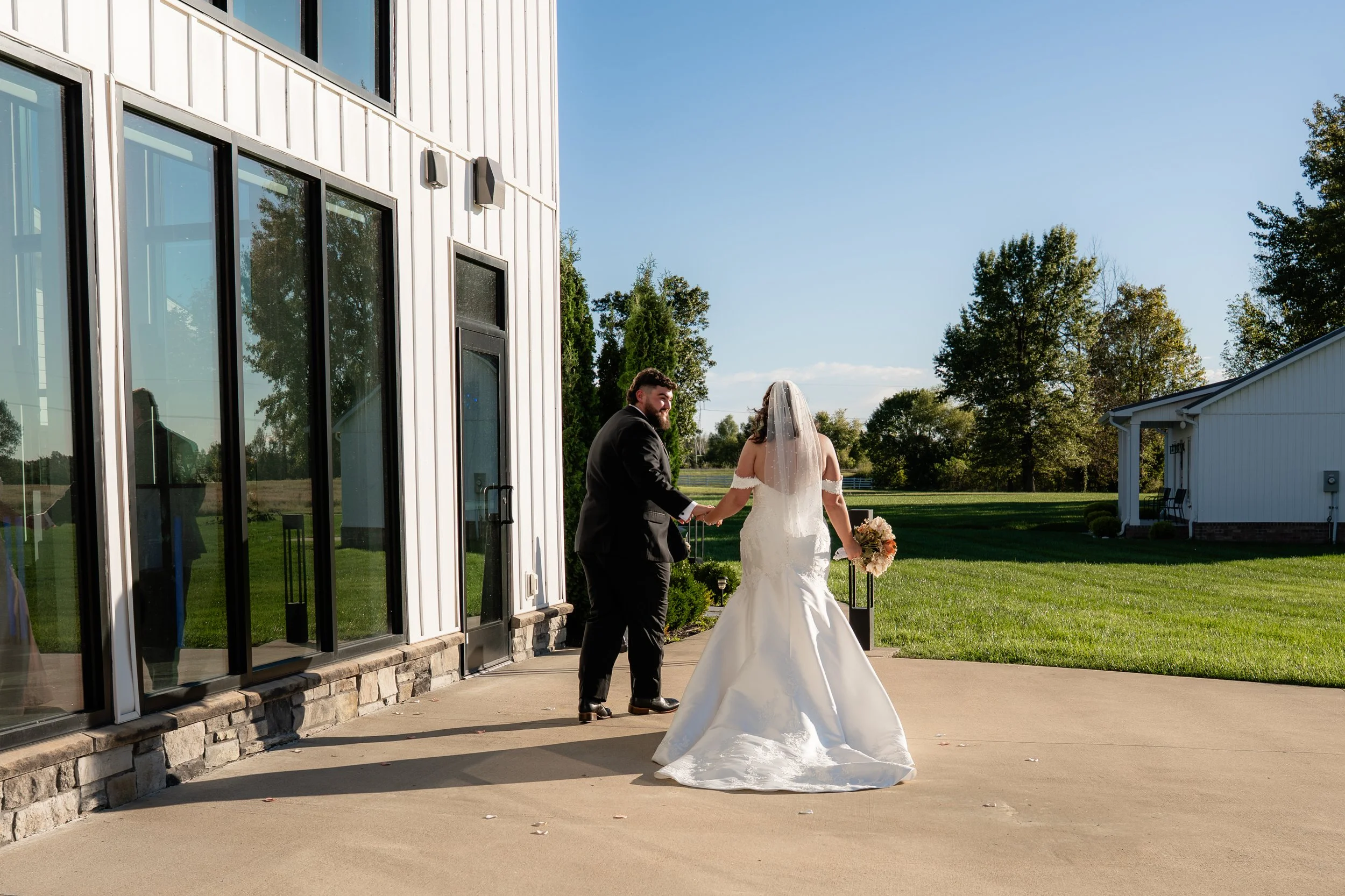 bride and groom photo walking out of the wedding ceremony together at the Commonwealth Event Center wedding venue in Paducah Kentucky