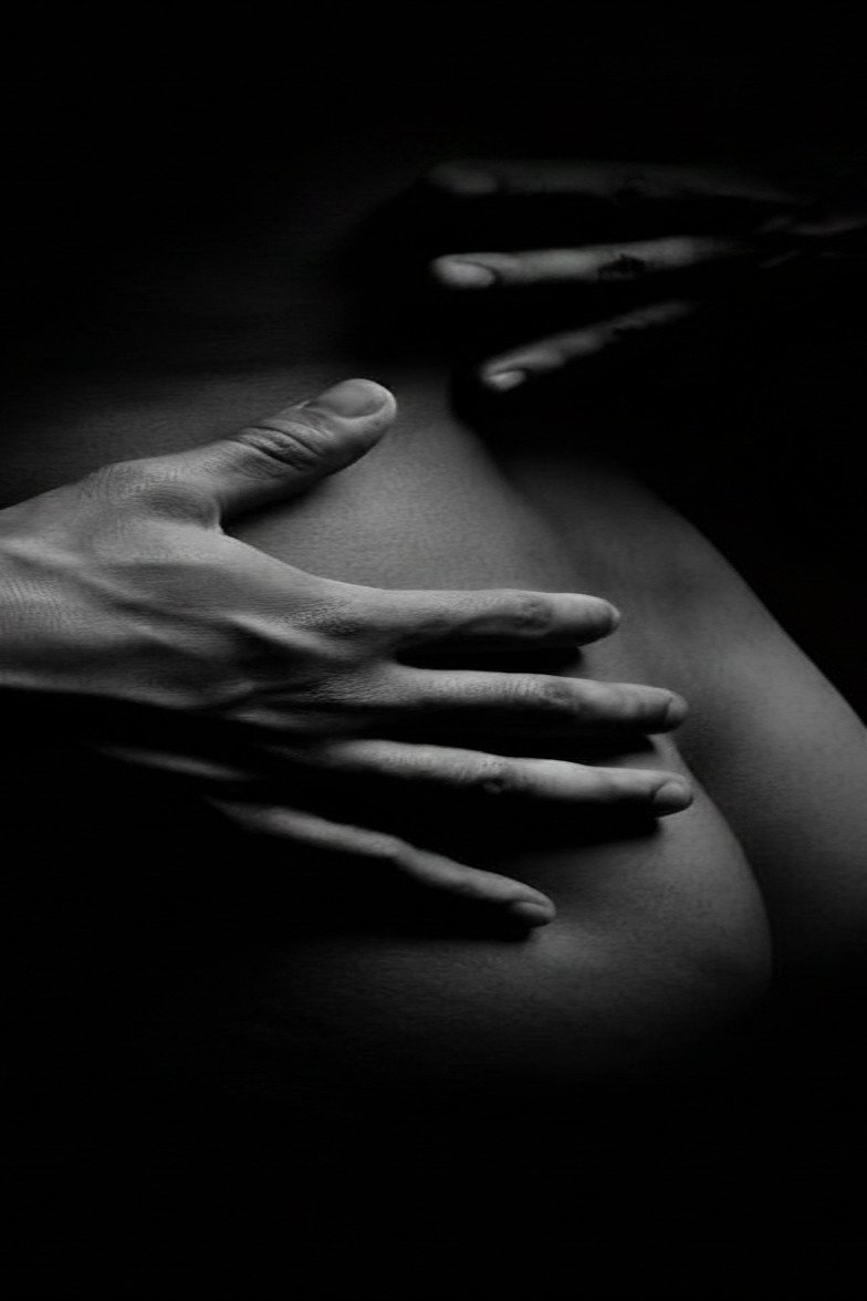 Black-and-white close-up of a couple embracing