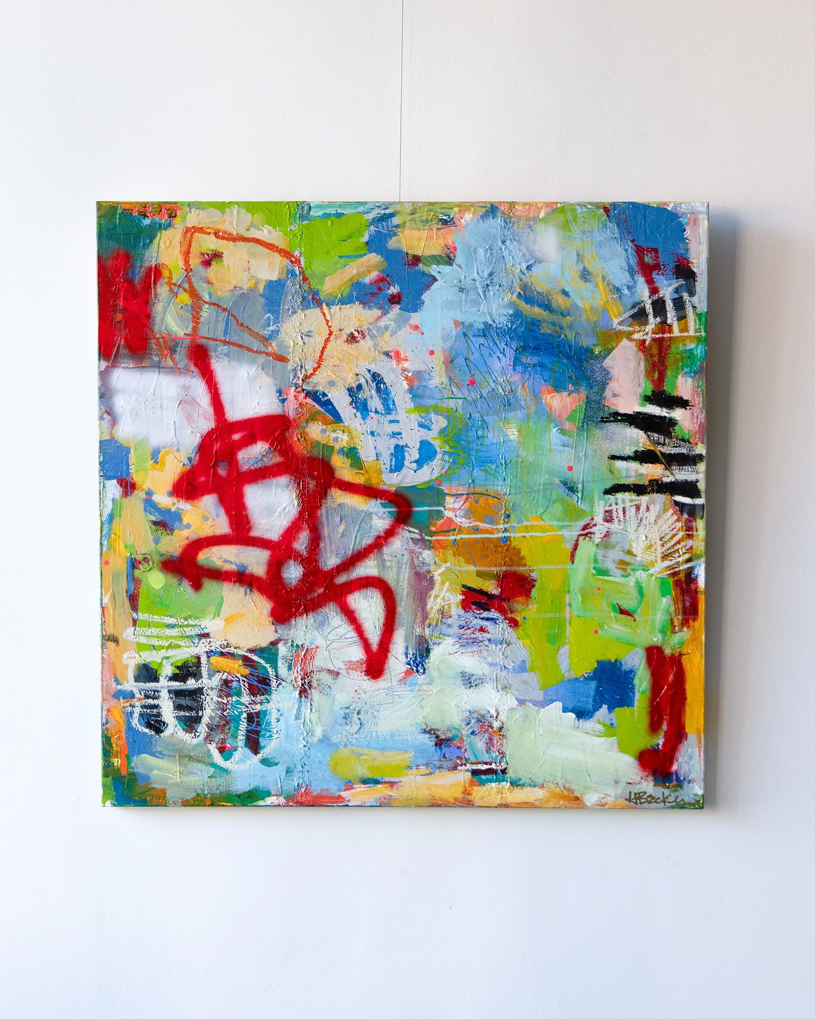 Wolfgang, 36 x 36 abstract painting by Heidi Becker with vivid blue, green and red, layered texture, spray-painted gestures and expressive marks.