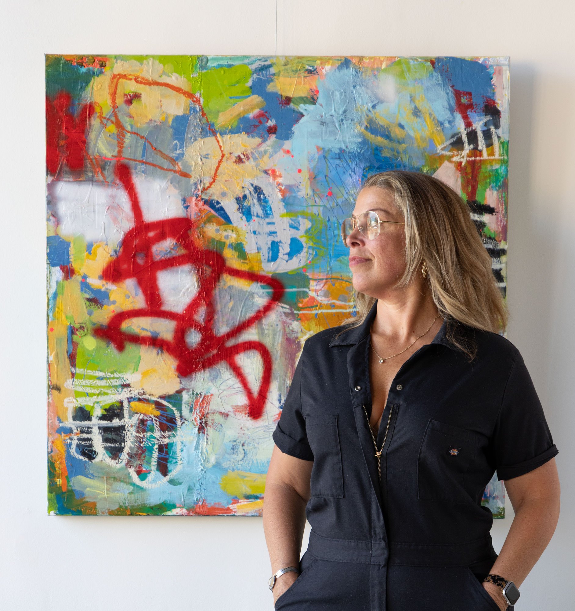 Artist Heidi Beck with painting titled Wolfie, 36x36
