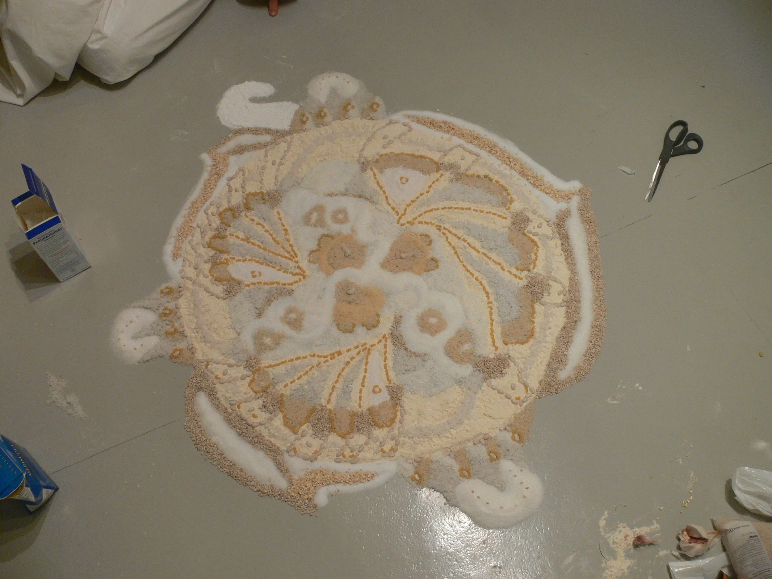 Mandala made of white foodstuffs. 
Photo by: Simo Saarikoski.