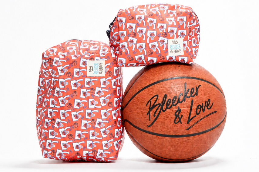 Autographed+basketball+with+orange+bags.png