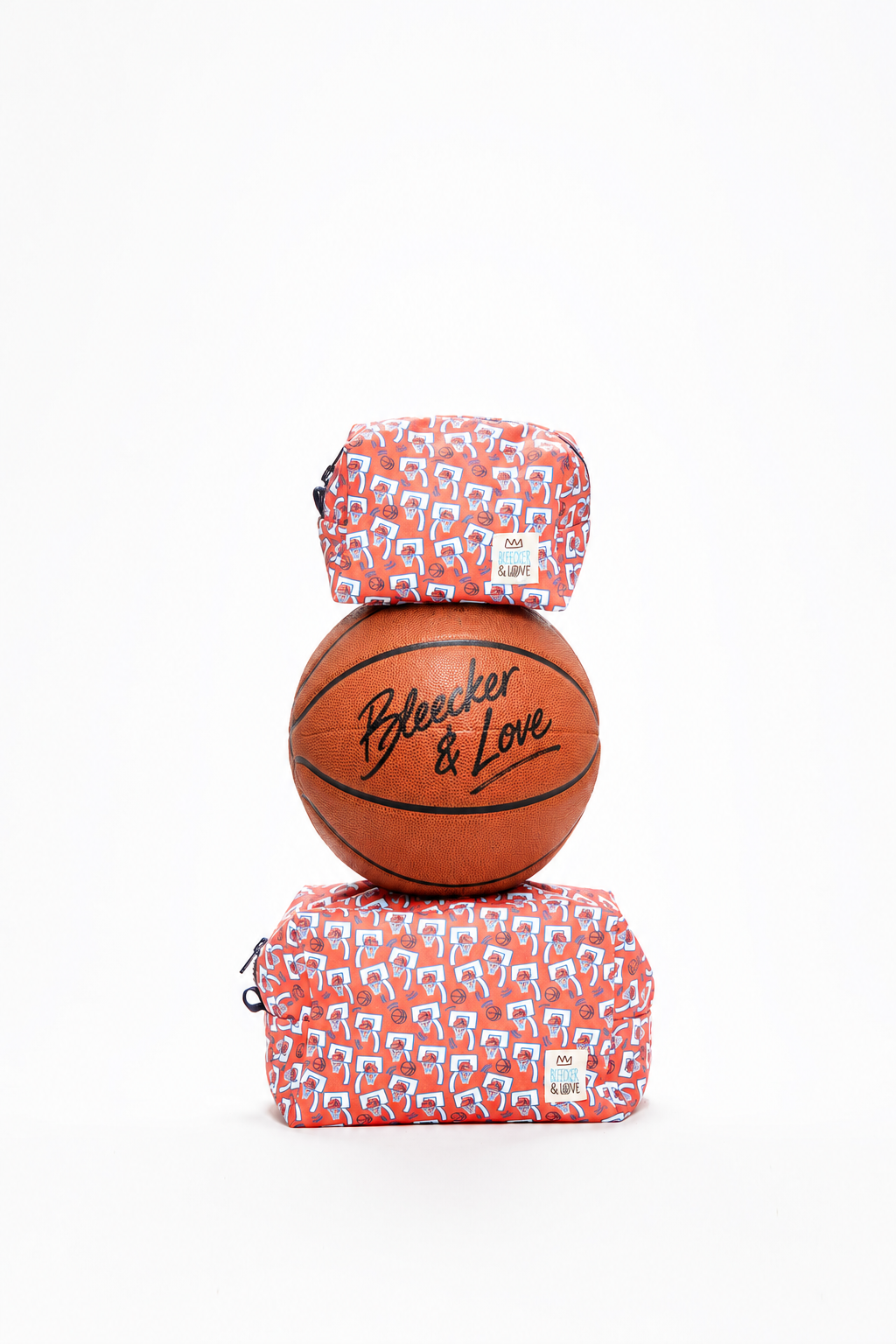 Signed orange basketball atop stacked bags.png