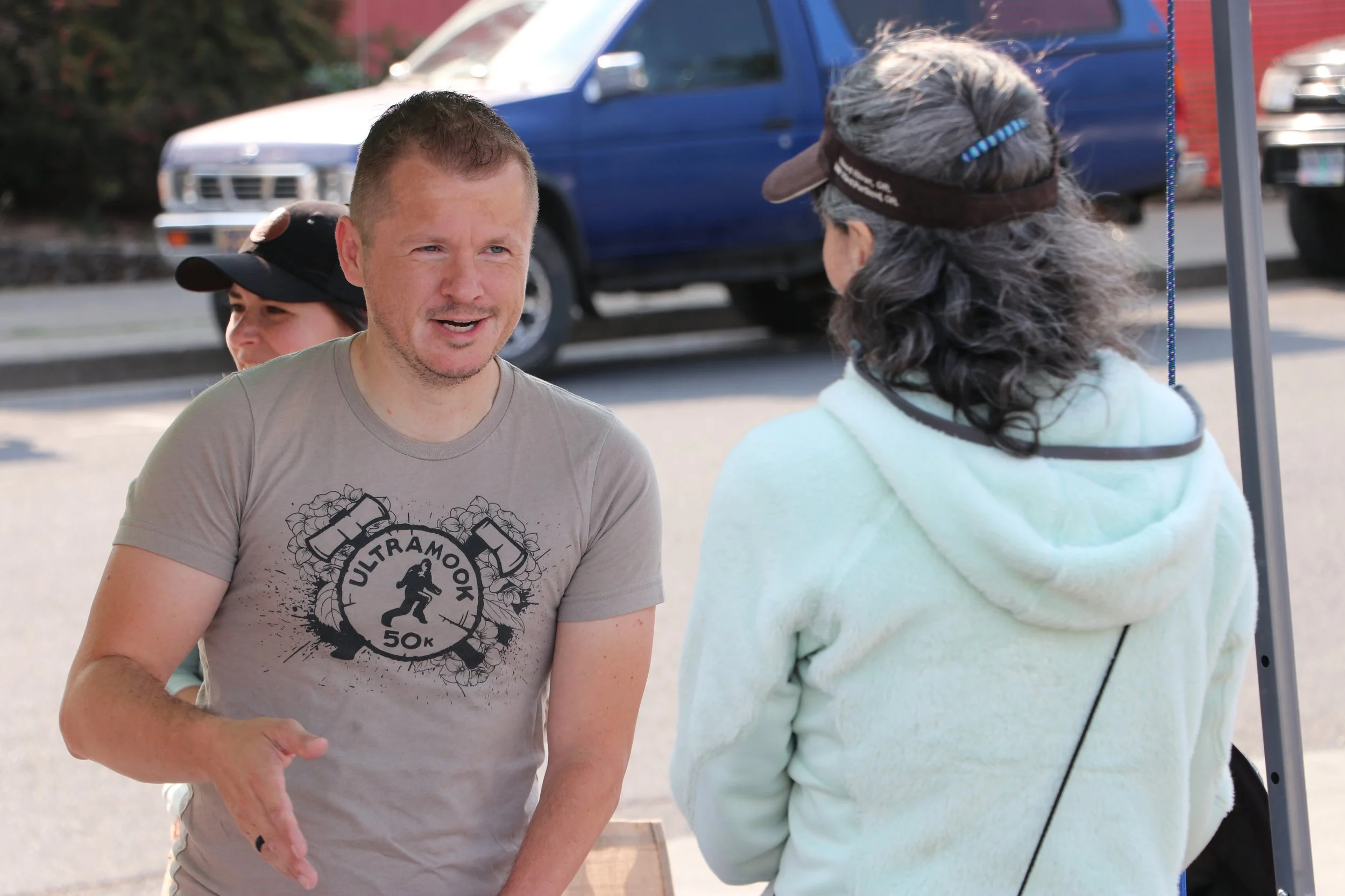 Commissioner interacts with public at event.JPG