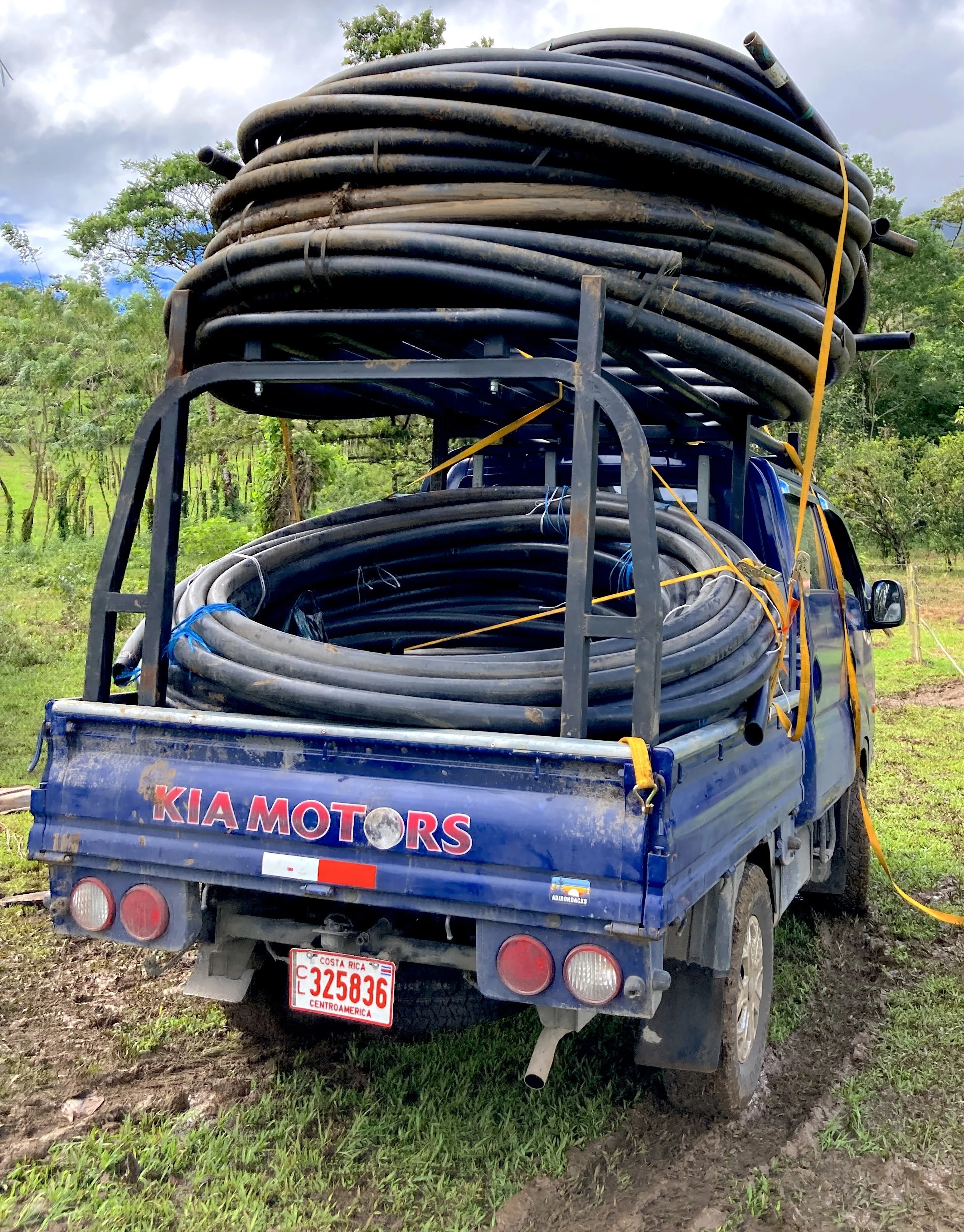 The Kia Bongo stacked with 2" PVC pipe in Colonia Blanca, Costa Rica.