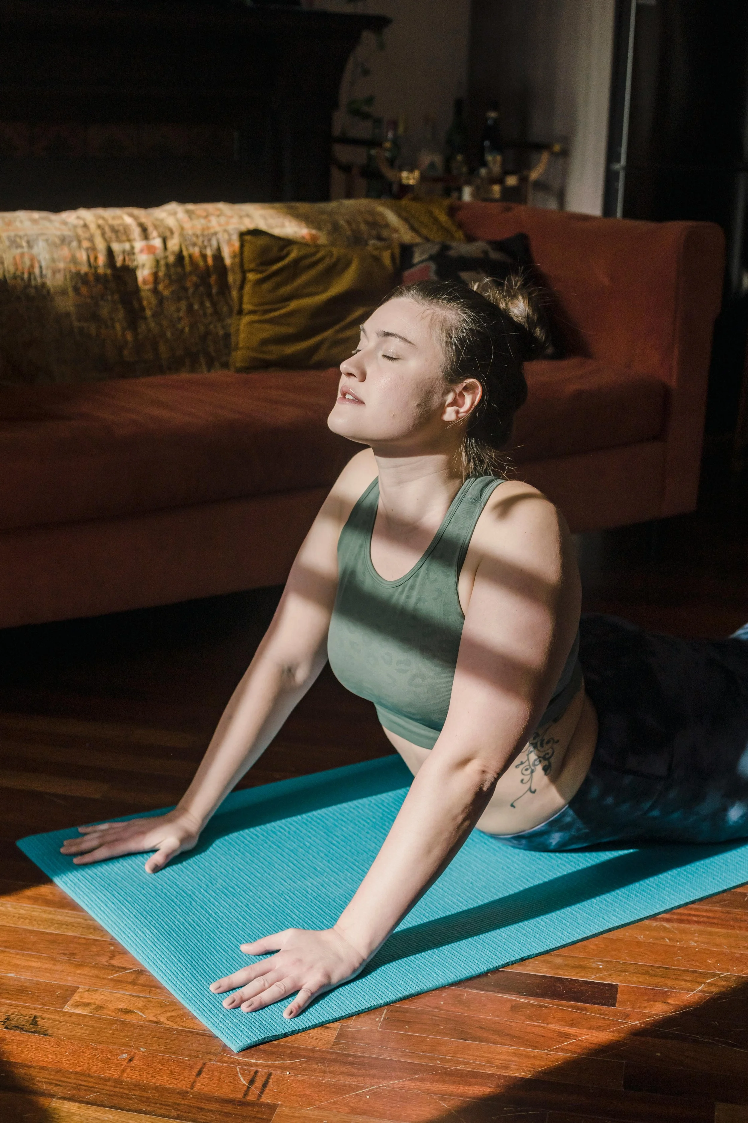 summer postpartum self care ideas - stretch during tummy time