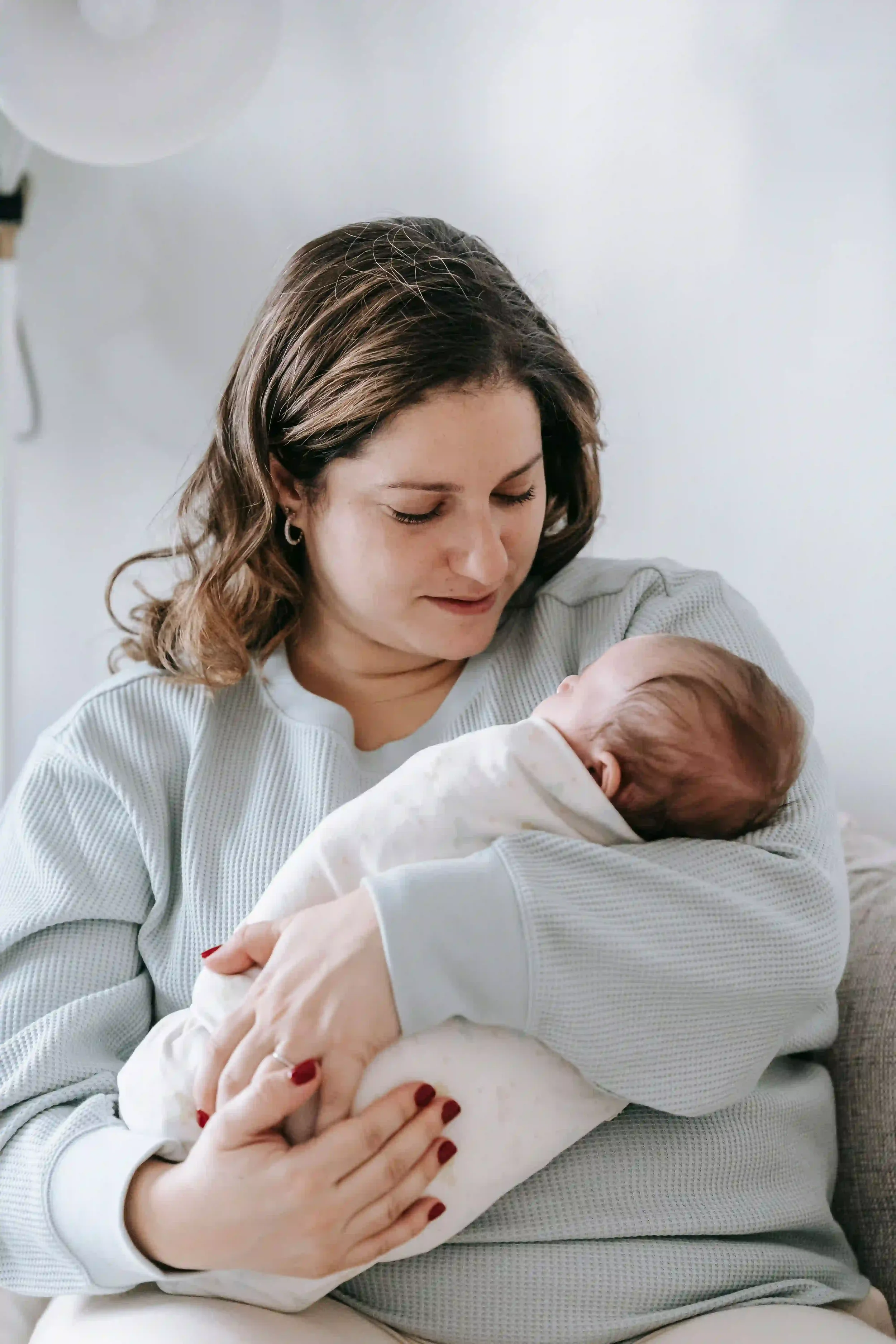 best baby sleep training tips for new moms - practicing pick-up-put-down sleep method with newborn baby