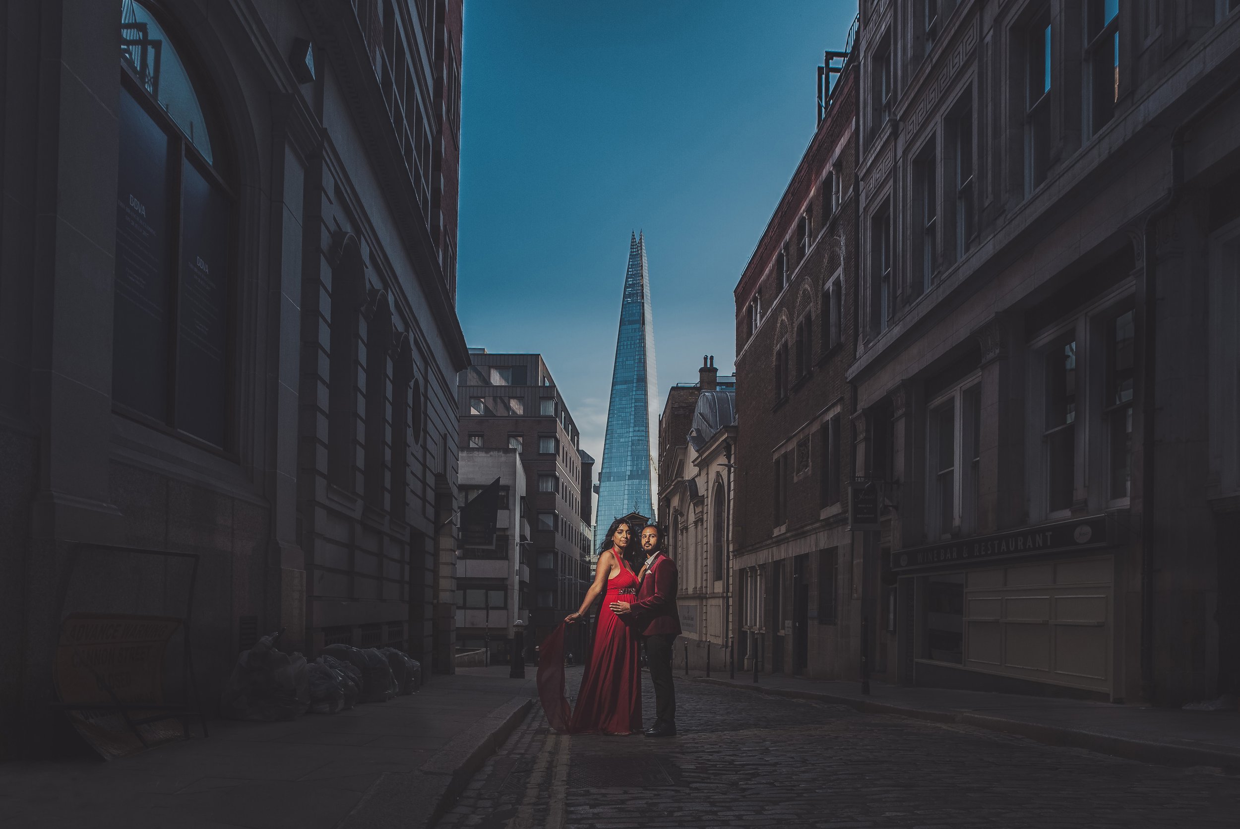 A fine art portrait of a couple in front of London's Shard building