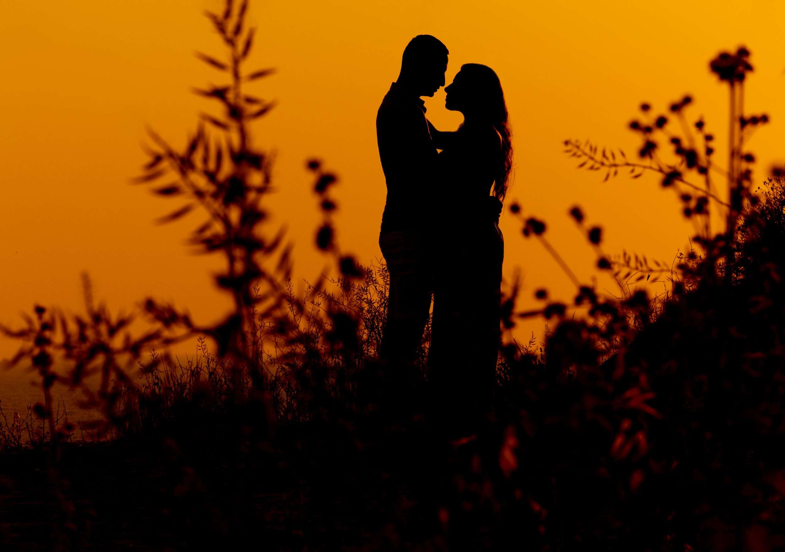 silhouette of a couple during sunset destination wedding