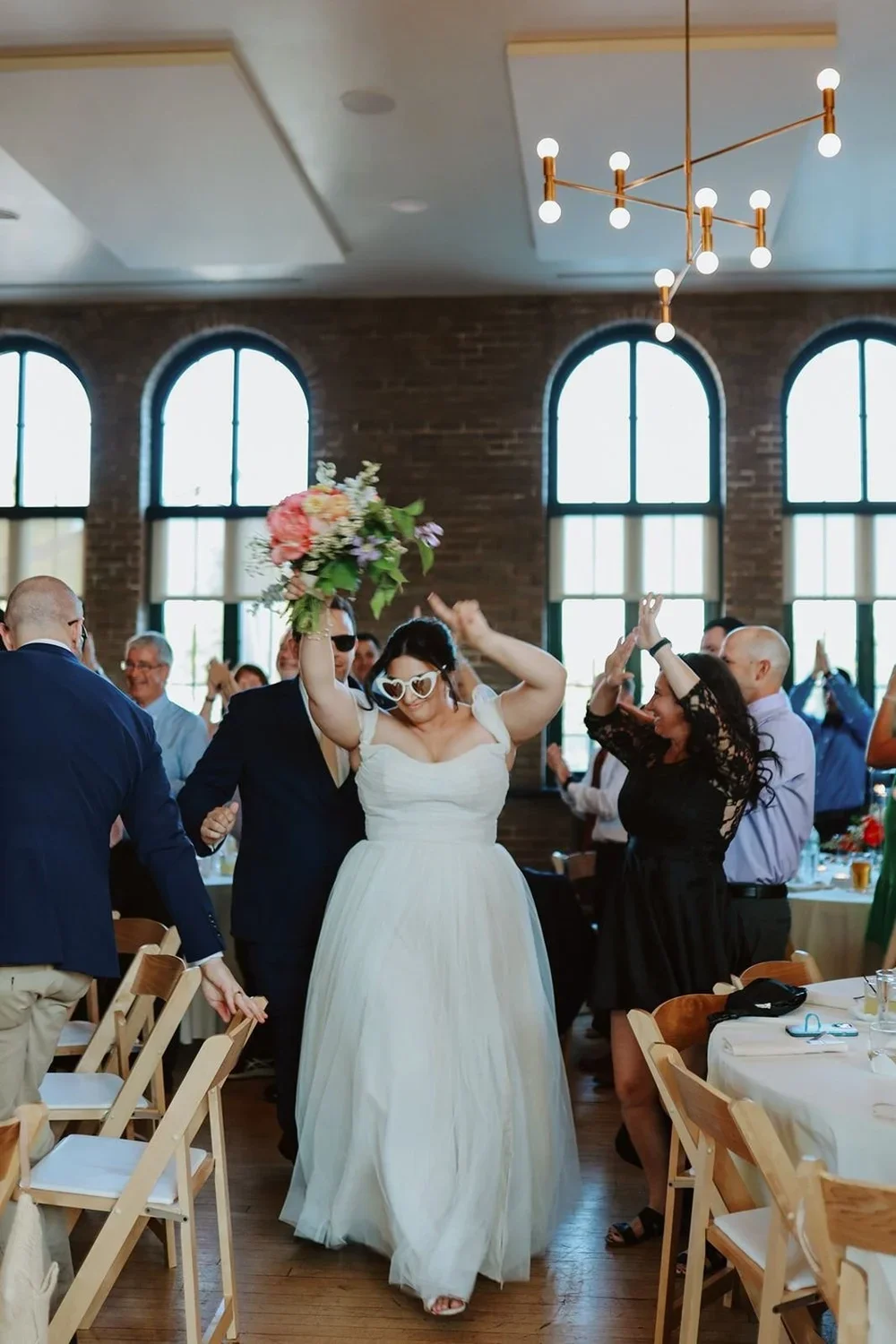 bride-reception-entrance-sunglasses.webp
