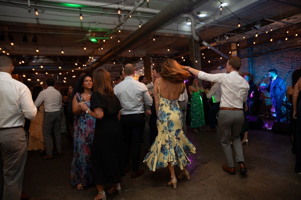 Guests dance at reception