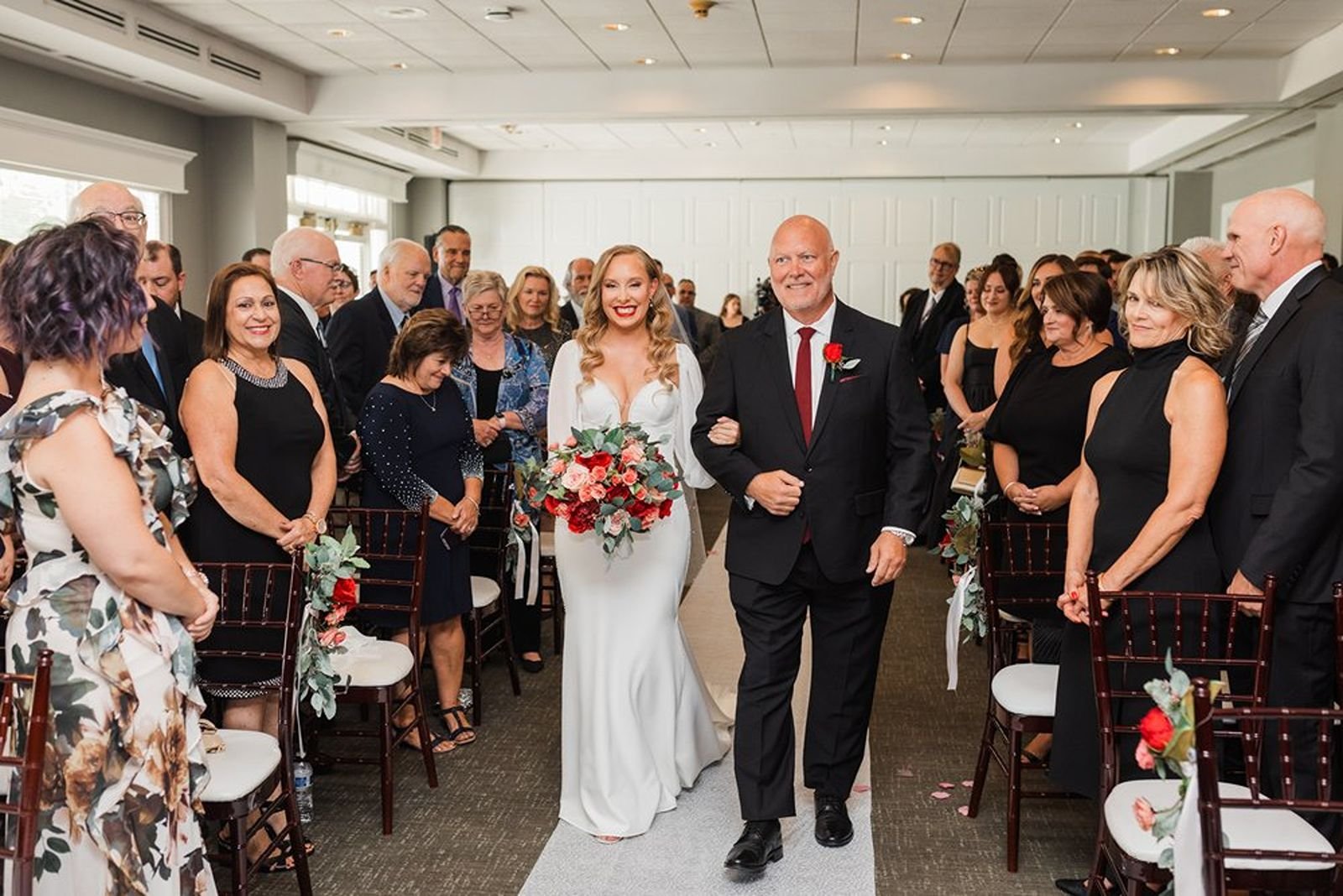 Bride and dad walk down the aisle