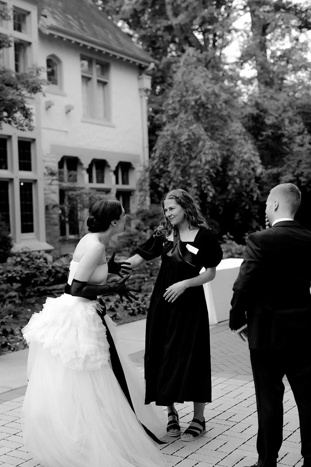 Bride and groom thanking their planner for their beautiful event