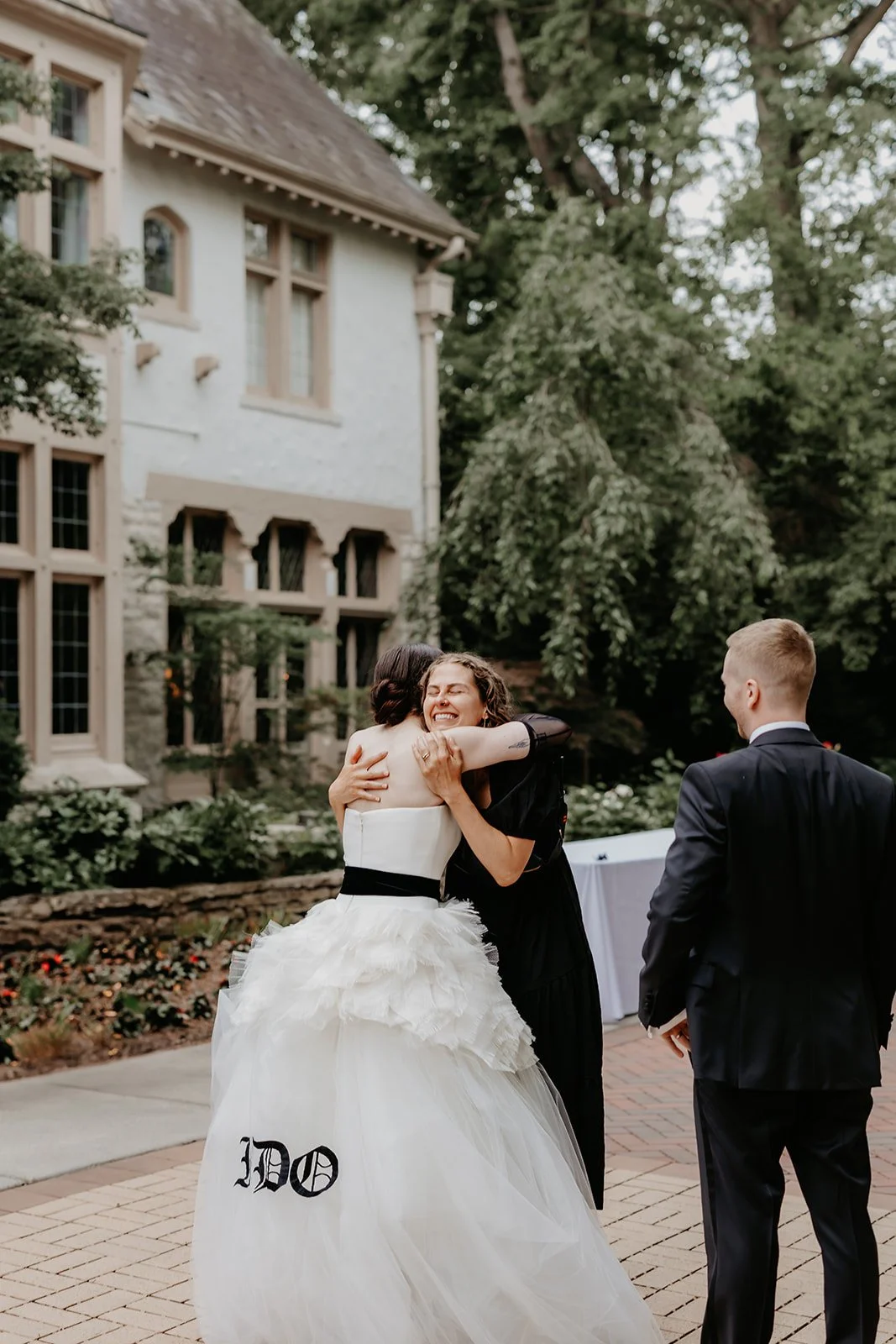 Bride hugs wedding planner at Ohio Governor's Residence