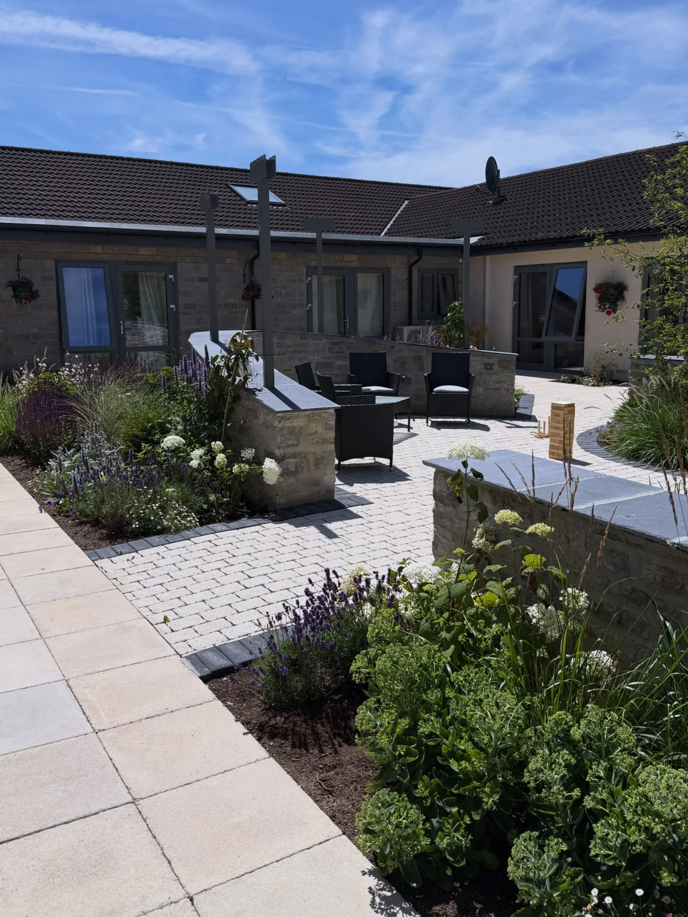 A recently completed courtyard garden, designed to bring a little more nature into everyday life for the residents of this nursing home in Somerton.

Our brief was to create a calm, restorative space where people could enjoy being outdoors, surrounde