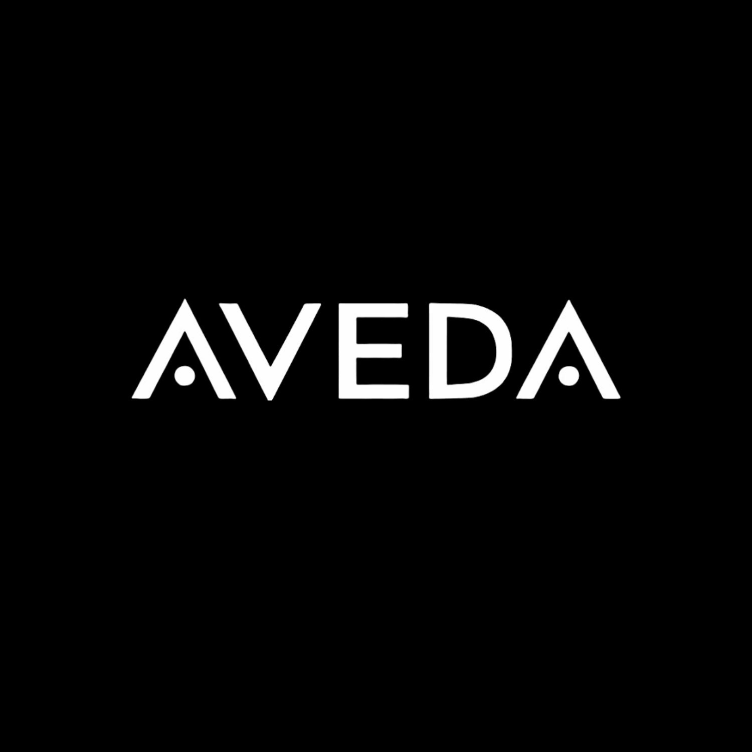 Black background with the white text 'AVEDA' in the center.