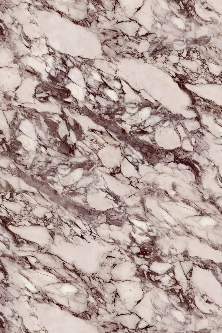 Close-up of a marble surface with white and brown veining.